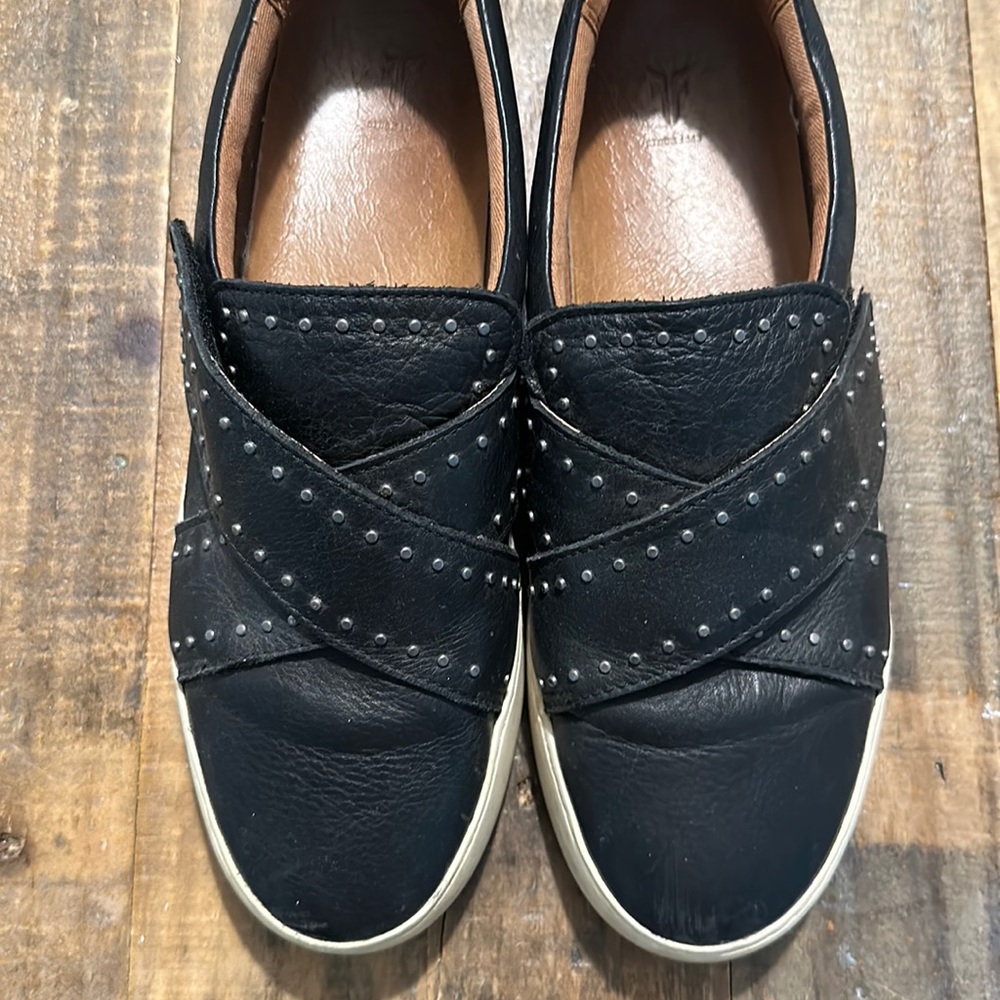 Frey black, genuine, leather sneaker-loafers, with metal embellishments.